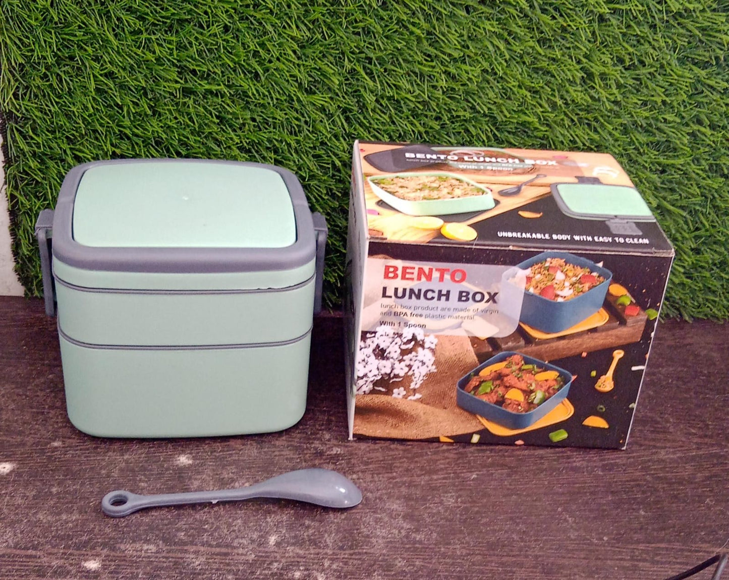 green lunch box with spoon